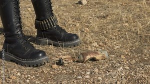 Exploded Artillery Mortar shell mine found by sapper biker woman Demining (Bomb disposal) mortar bomb.
