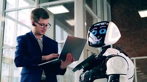 Cyborg and businessman are talking through the computer. Robot, cyborg oncept.