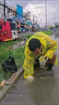 Volunteer to Cleaning Plastic Unclog Drain After Rainstorm Flooding