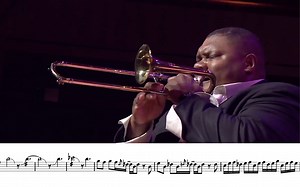 Big man plays tiny trombone