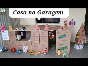 Cardboard house in the garage with a dance floor for the triplets.