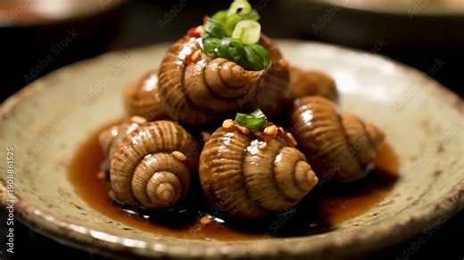 Gourmet Cooked Snails or Whelks Served in Savory Dark Sauce and Garnished with Green Onions on a Rustic Plate, A Popular Asian Seafood Appetizer Delicacy