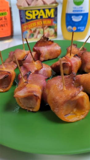 Spam Bites Today I want to show you a recipe from the offical SPAM website. We wrap half a piece of partially baked bacon around our precut Spam cubes (fixate with a tooth pick or something oven safe, not plastic). Combine apple juice, honey, yellow mustard and the glace is done. Dunk your bacon wrapped spam bites in the glace and in the oven it goes. Boom, done. #easyrecipe | We like it too | Facebook