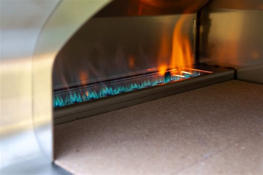 Gas precision or wood-fired flavor? With the Volta, you get both. 🔥 Use the smart tech and precision of the Volta - or convert it with our hybrid kit for an authentic wood-fired experience. The best part? No lost cooking space. The burner cover and wood holder stack seamlessly so you keep the full cooking surface whether you’re cooking with gas or wood. High-tech performance. Real wood-fired flavor. That’s the Volta by Fontana. 🍕🔥 #FontanaForni #VoltaOven #WoodFiredCooking #SmartOutdoor Oven 