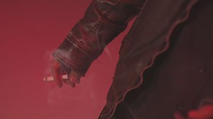 Man dressed as a devil smoking a cigarette - Free Stock Video