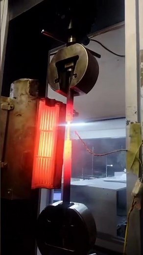 AT 1000 DEGREES CELSIUS PERFORMING TENSION TEST IN METALLURGICAL TESTING LABORATORY AS PER ASTM A370