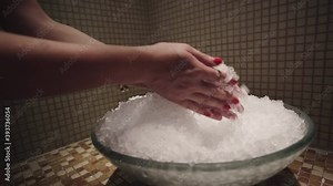 Woman spa skin treatmant with ice crystals after hot sauna. Hot and cold treatment in spa salon