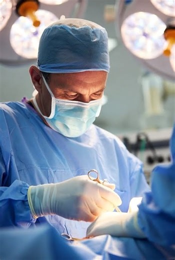an orthopedic surgeon performing surgery of bone 2
