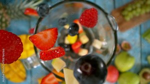 Super Slow Motion of Falling Fruit Pieces into Blender. Camera Follows the Fruit. Filmed on High Speed Cinema Camera, 1000 fps.