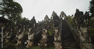 Low angle close up truck shot of stunning dragon head stone sculptures in Pura Penataran Agung Lempuyang temple in Bali Ancient stone sculptures and staircases in Hindu temple Stock Video
