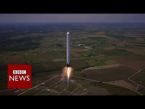 Reusable rocket blasts off and returns to earth - BBC News