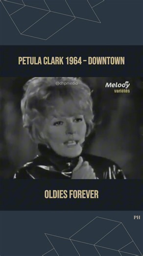 Petula Clark 1964 – Downtown ... 🎉 Listen full the song: https://golden.thedailysongs.com/petula-clark-1964-downtown/?utm_source=facebook&utm_medium=reel&utm_campaign=goldenvibes ... Released in 1964, Petula Clark’s “Downtown” became an instant classic and one of the defining pop hits of the decade. Written and produced by Tony Hatch, the song captures the bright optimism and escapism of city life, inviting listeners to leave their worries behind and find joy “downtown.” With Clark’s radiant vo