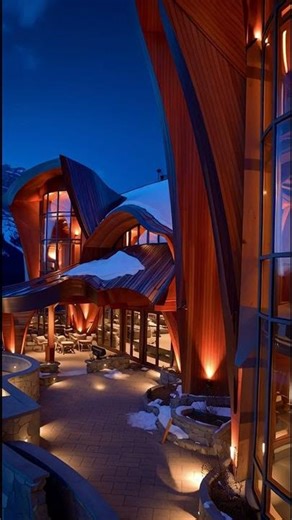 Sculpted Serenity Alpine Lodge with Fluid Wooden Architecture