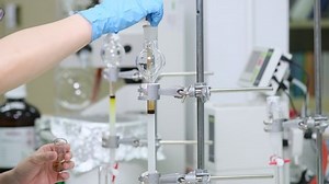 clip-1051905967-scientists-wear-blue-gloves-load-samples-into