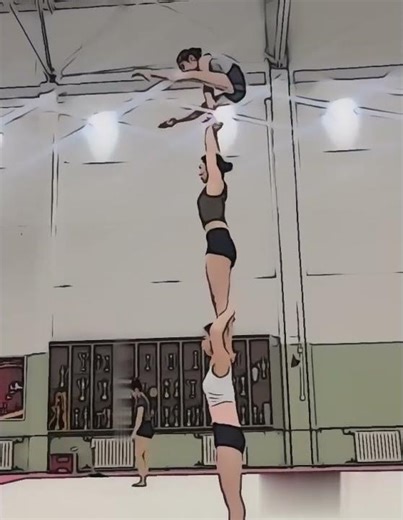 3 Girls Performing a Vertical Acrobatic Stack