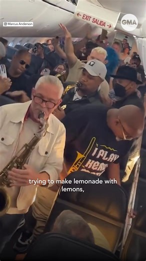 After their flight was rerouted due to mechanical issues, the Summer Horns jazz band pulled out their instruments to lighten the mood on their Seattle-bound plane. | Good Morning America