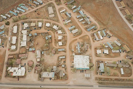 Military base town with 27 occupied homes, cafe and post office for sale