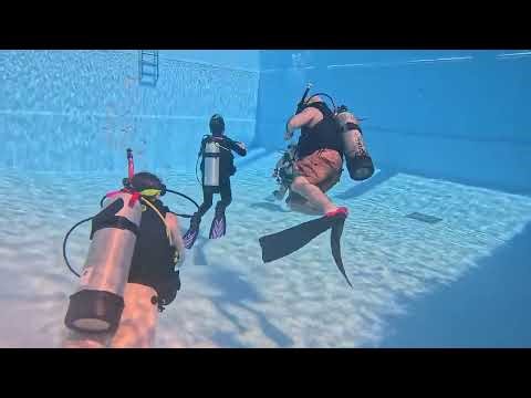 Scuba Divers Training in pool