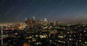 Night aerial view of downtown Los Angeles, California. Downtown Los Angeles at night from drone. Night illuminated flight over Los Angeles city downtown panorama. Los Angeles night buildings skyline.