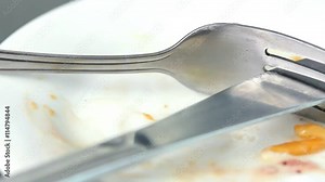 Symbol of placing a fork and knife after eating .do not like.not delicious