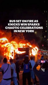A bus transporting football fans from a World Cup game was set alight in New York as thousands of people poured into the streets to celebrate the Knicks’ win in the NBA Finals. Some fans set off fireworks and fired smoke grenades, chanting “Knicks in 5!” to mark their team’s victory in the 5th game of a possible 7. It was not immediately clear if anyone was injured in the incident. At least 3 more shuttle buses were reportedly badly damaged by crowds. #knicks #knicksbasketball #fire #worldcup202