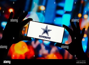 In this photo illustration, the Dallas Cowboys logo is displayed on a smartphone screen. It is a professional American football franchise. The team competes in the National Football League for the Eastern division of the National Conference Stock Photo - Alamy