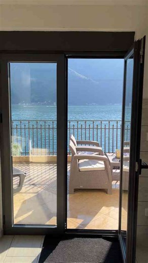 Breathtaking Lakeside Views from a Serene Balcony Retreat