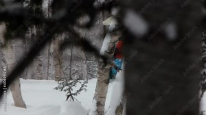 Brave Skiers Ride Snowboards Among Thick Forest. Dangerous Mountain Trail. Extreme Freeride. Ski Track Among Trees. Deep Snow. Snowboarders Flicker Among Trees. Rides Fast. Danger. Collision. Bright