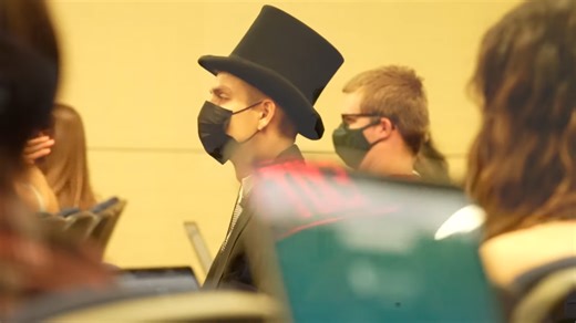 An unexpected visitor silences a packed college lecture hall