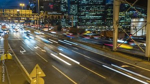 hyper lapse video of night traffic on the urban thoroughfare and road junction