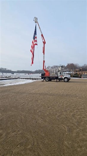 Thank you Kery Costello from Century Tree for the flag and national anthem! Let's get this fishing derby started! | Channel Lake Beach Bar