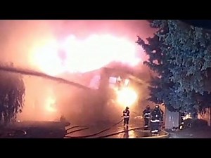 Firefighters escape burning home's fall