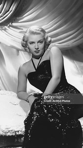 This one of a kind 1943 Gilbert Adrian fully beaded trained gown was custom-made for the iconic Hollywood actress Lana Turner. She famously wore this couture masterpiece for her publicity photographs promoting MGM’s film ‘Slightly Dangerous’, and the gown proved so striking that it was featured prominently across multiple original movie posters. Adrian was renowned for shaping the visual identity of Hollywood’s leading ladies at the time—divas such as Garbo, Shearer, Crawford, Garland, and Harlo