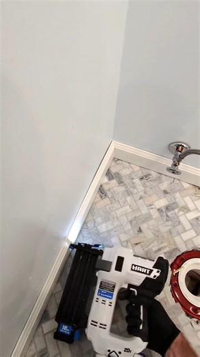 PVC baseboard installed in bathroom POV