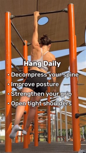 Karin Bensabat on Instagram: "Why hanging? Decompress your spine – Hanging lets gravity gently create space between the vertebrae, relieving pressure and tension from sitting or lifting. Improve posture – It counteracts rounded shoulders and slouched habits by naturally aligning your spine and opening your chest. Strengthen your grip – Supporting your bodyweight builds grip endurance and forearm strength without any extra equipment. Open tight shoulders – The overhead position stretches the lats