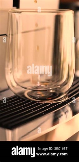 Coffee pouring into double walled glass mug in sleek office coffee machine unit. High quality 4k footage Stock Video Footage - Alamy
