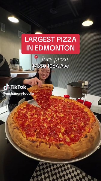 📍 Lore Pizza | Edmonton This is the largest pizza in Edmonton at 24 inches! 🍕 It’s a New York style pizza that’s 24” in size. Depending on the type, it can cost $44 to $48. #giantpizza #yegfood #yeg #edmonton #edmontontiktok #edmontonalberta