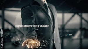 Internet der Dinge with hologram businessman concept, in English Internet of things