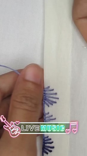 Embroidery Process: Creating Stitches with Purple Thread