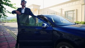 Corporate Man Steps Down Parked Car Stock Footage Video (100% Royalty-free) 3715299129 | Shutterstock