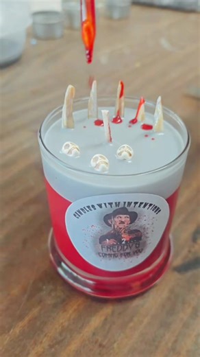 🔥🕯️ One… two… Freddy’s coming for you. 🕯️🔥 Our Freddy Candle is made for the horror lovers who know the real monsters come out after dark. Hand-poured with intention, this candle brings dark nostalgia, nightmare energy, and serious slasher vibes to your space. Perfect for: 🖤 Horror movie marathons 🖤 Nightmare-on-Elm-Street fans 🖤 Collectors of our Killer Intention Line 🖤 Spooky décor lovers who sleep with one eye open Light it, set your intention, and let the nightmares stay where they b