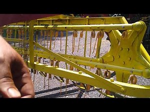 Replacing tines on the New Holland hay rake. upkeep of farm equipment