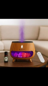 Create a calming home environment with this flame-effect aroma diffuser featuring natural Himalayan salt rocks. The built-in LED flame light adds a warm, soothing glow while ultrasonic mist technology gently releases fragrance into your room. Perfect for relaxation, sleep, meditation, office ambience, and home décor. Includes a remote control for easy operation, multiple mist modes, and adjustable flame colors.🔹 Key Features Flame Effect Design: Realistic LED flame adds warmth and ambience to a