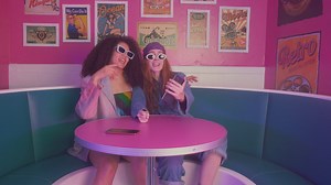 Two girls dancing in a retro restaurant - Free Stock Video