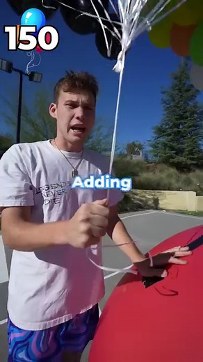 How many balloons does it take to make a GIANT Beach Ball fly? | Jesser