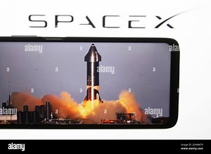In this photo illustration, the launch of a starship SN8 prototype rocket of SpaceX at the company Boca Chica seen on a fragment of a youtube video displayed on a smartphone Stock Photo - Alamy