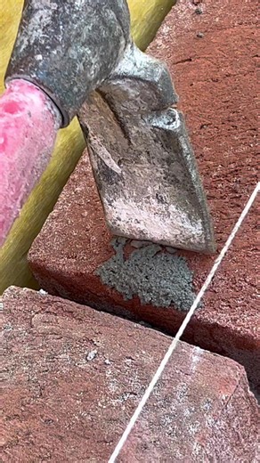 Hammering Away Mortar: Brick Wall Restoration