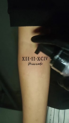 Roman Numerals | Birth date Last Name #herinkstattoostudio #femaletattooartist #gensantattooartist #minimalisttattoo #scripttattoo