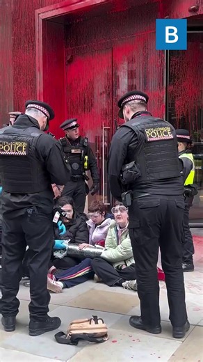 This is the moment an activist group covered an insurance building in red paint | Bristol.Live