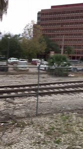 IITW - A girl in black bathing suit taking pictures on abandoned railroad, Los Angeles, CA - 24 Jan 2020